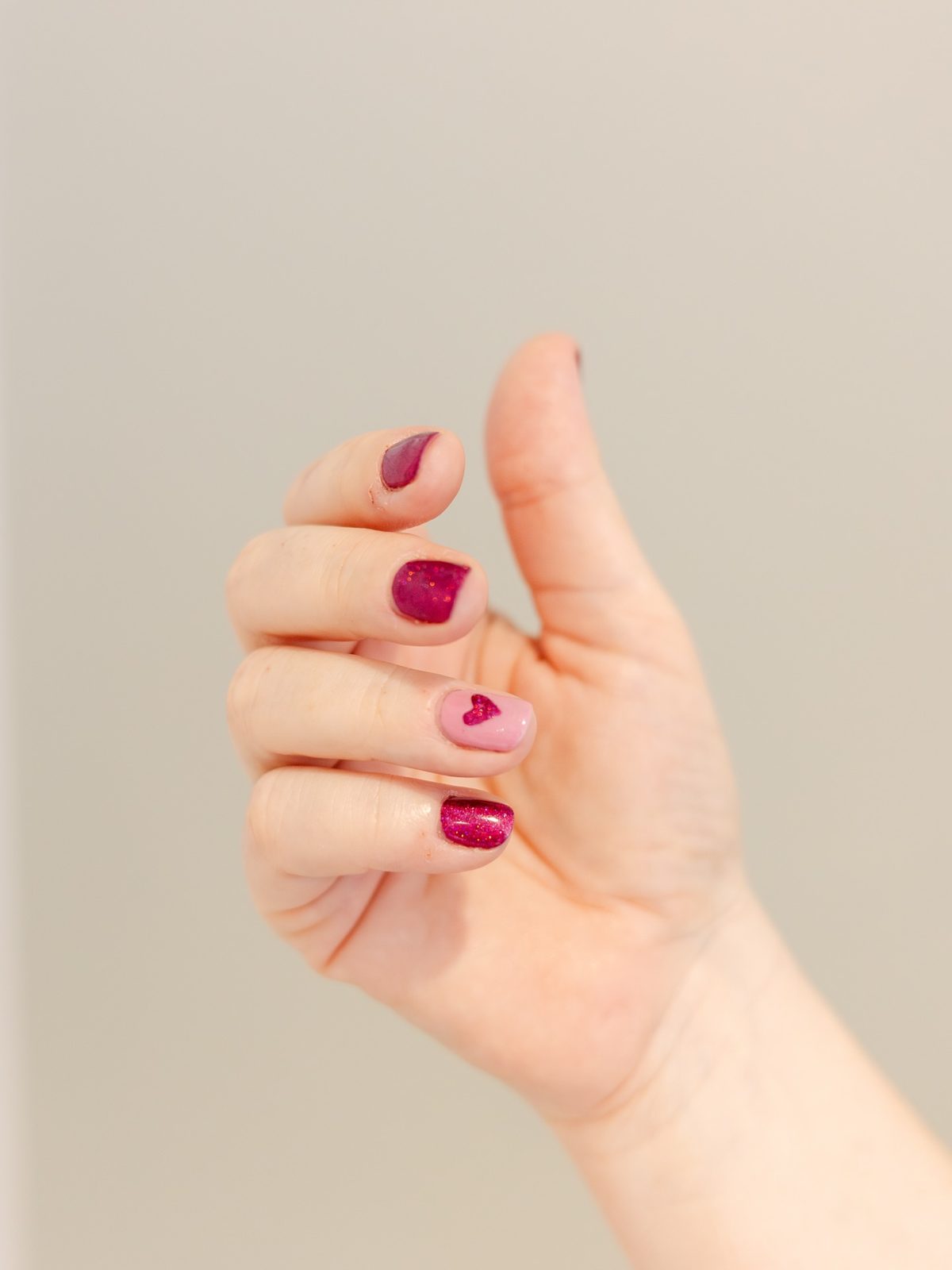 Berry gel nails with a heart